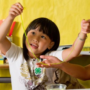 young girl doing a 4-H project